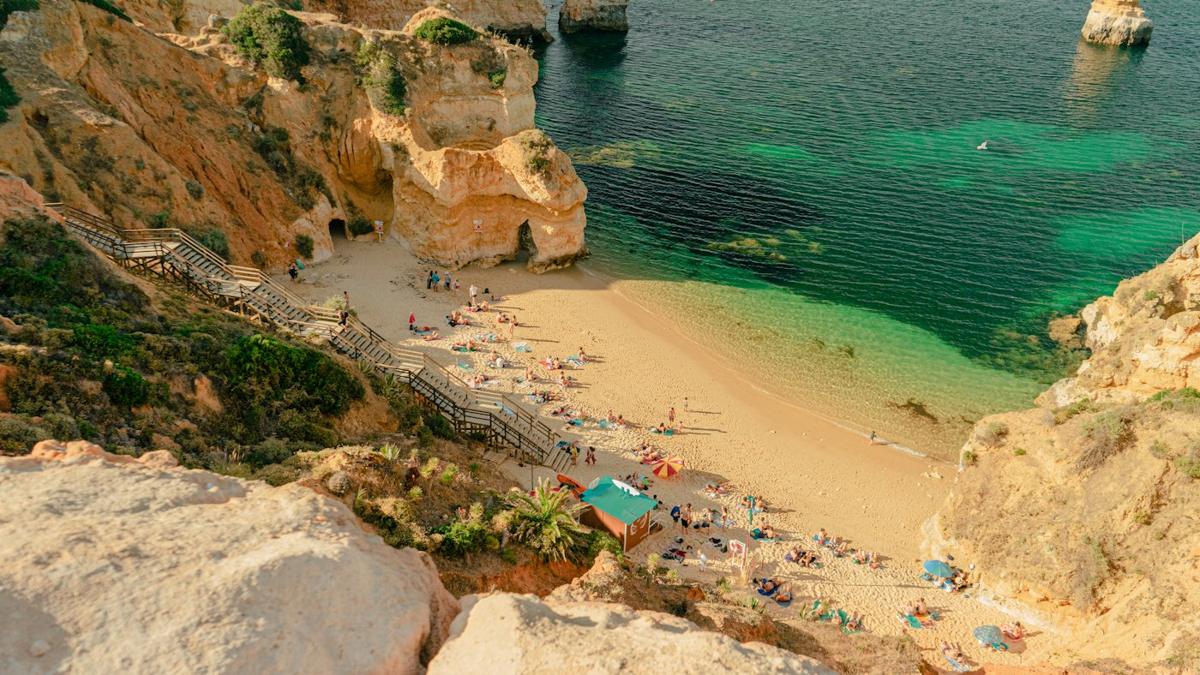 Turquoise water and golden cliffs on the Algarve coast